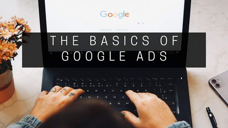 Google search being done on laptop, hands typing, text The Basics of Google Ads
