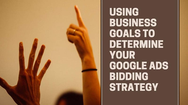 Hands up in air, text Using BusinessGoals To Determine Your Google Ads Bidding Strategy