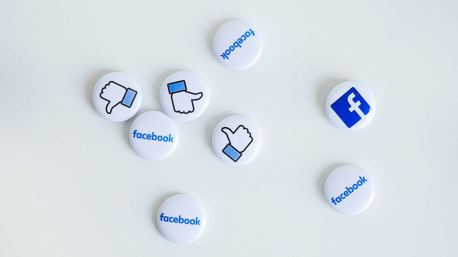 Buttons with Facebook logos and 'like' icon.
